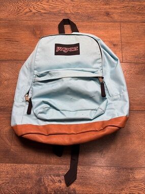 Jansport Light Blue Backpack with Brown Leather-Style Base